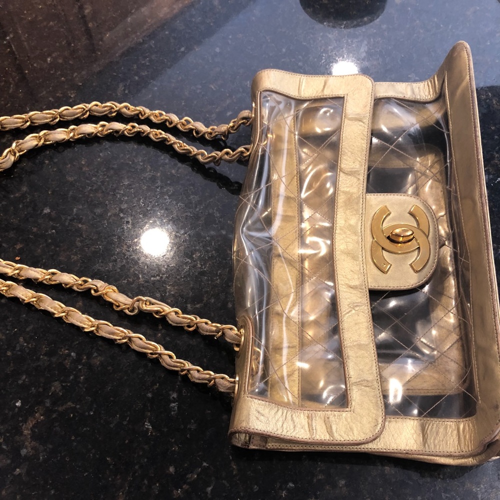 Authentic vintage Chanel handbag. Clear and gold